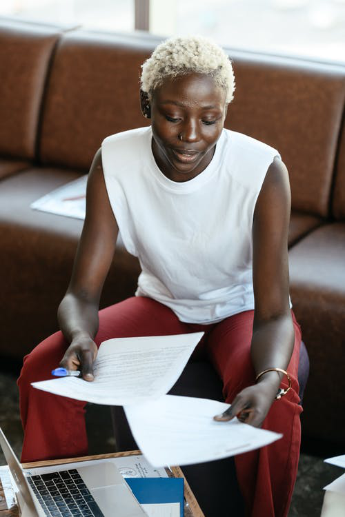 A woman holding papers