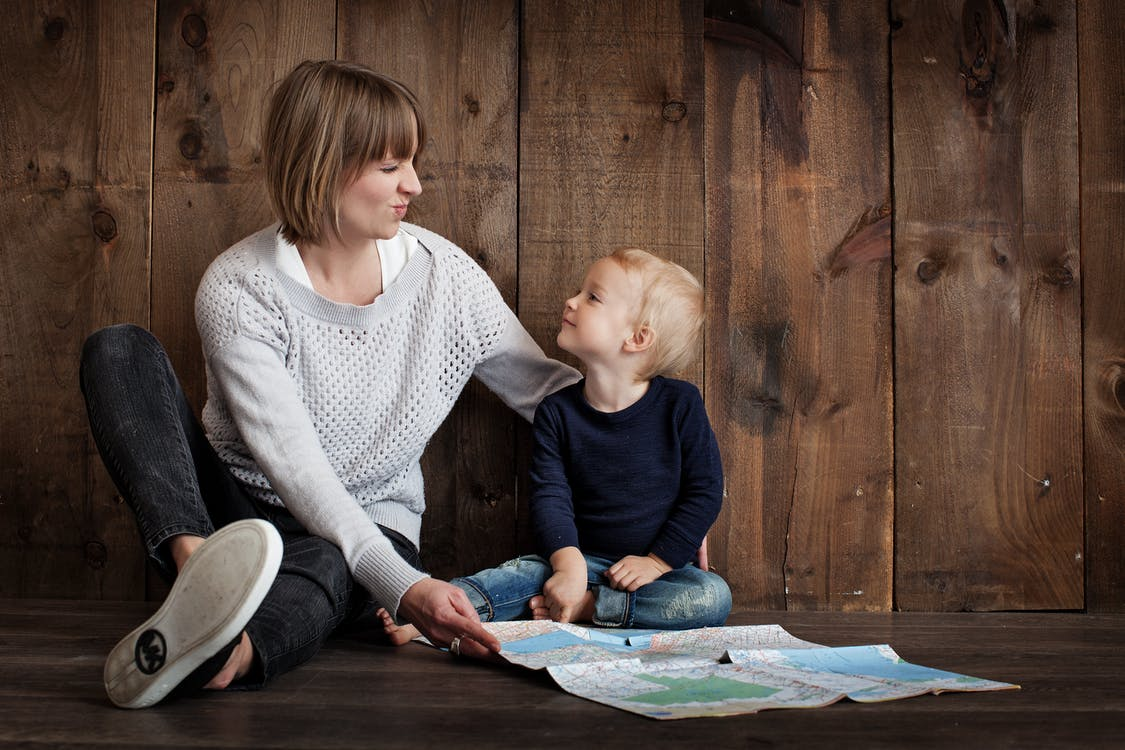 Nanda & Associate Lawyers Canada - Mother and son looking with a map