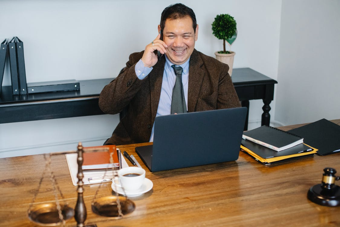 A lawyer speaking on the phone to someone