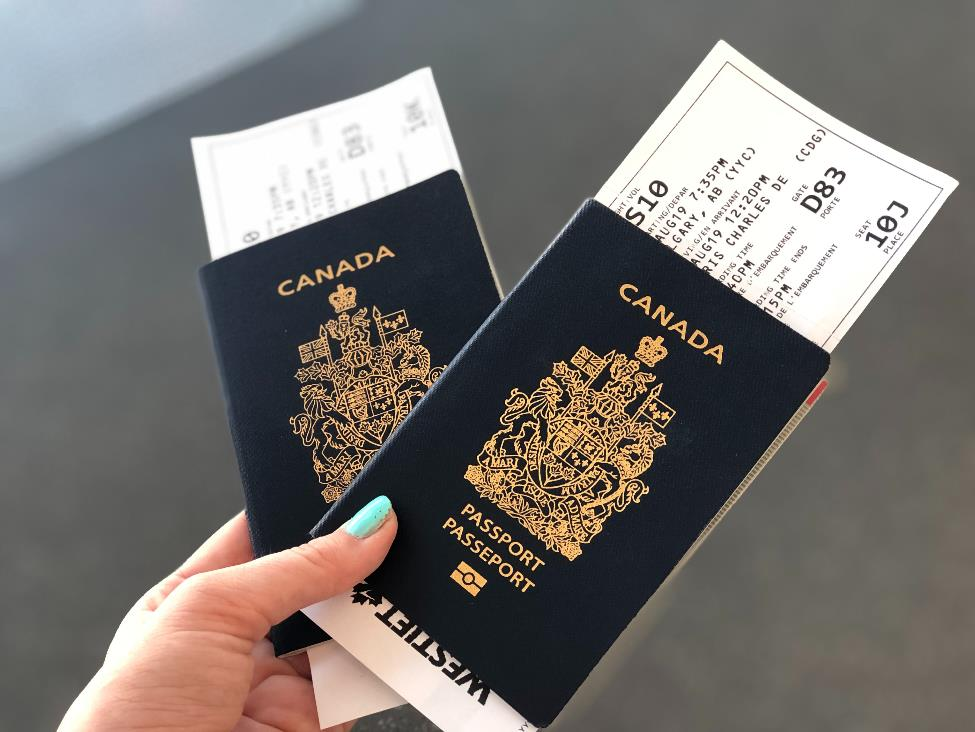 Canadian passport and ticket