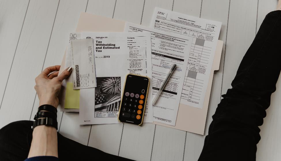 A woman calculating taxes