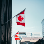 Nanda & Associate Lawyers Canada - Two Canadian flags are attached to the wall