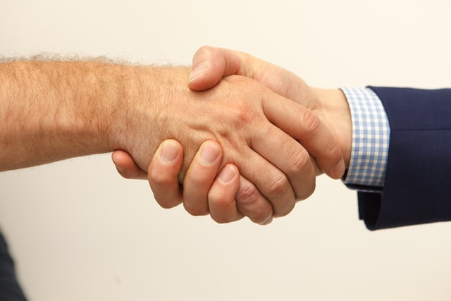 Nanda & Associate Lawyers Canada - An individual shaking hands with a lawyer
