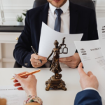 Nanda & Associate Lawyers Canada - A divorce lawyer finalizing joint divorce paperwork
