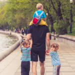 Nanda & Associate Lawyers Canada - A father taking his children for a walk.