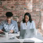Nanda & Associate Lawyers Canada - Two colleagues sitting at the table
