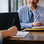 Nanda & Associate Lawyers Canada - a woman filling a job application in an office