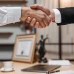 Nanda & Associate Lawyers Canada - A lawyer and a client shaking hands.