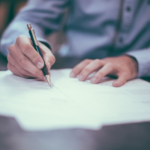 Nanda & Associate Lawyers Canada - Personal injury lawyer signing legal documents