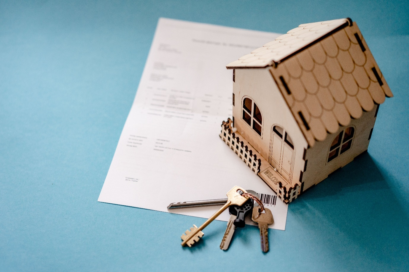 Nanda & Associate Lawyers Canada - Rental document with a miniature wooden house and keys.