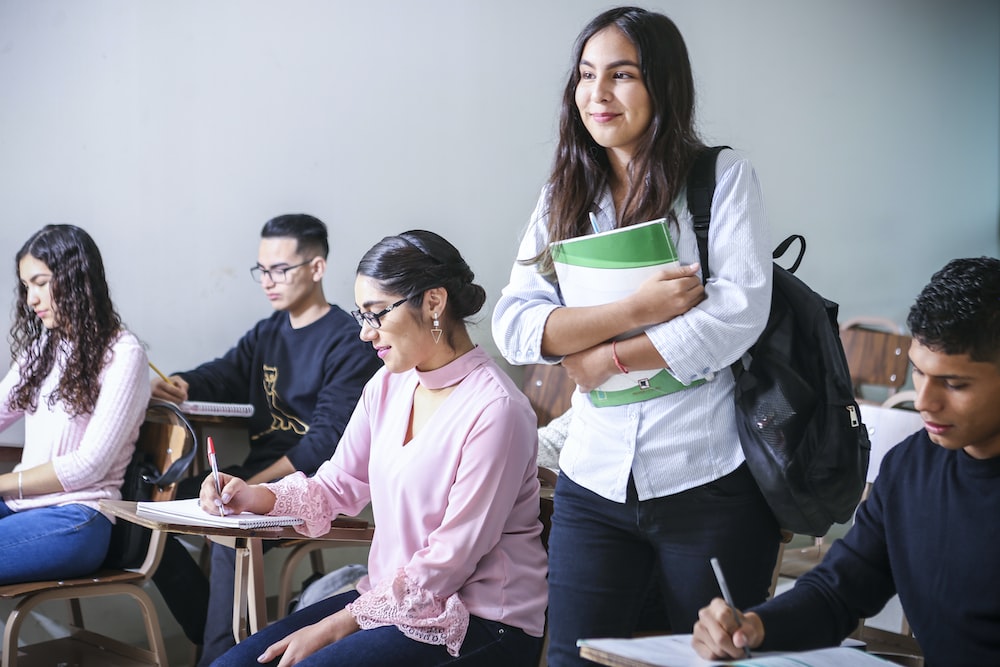 Nanda & Associate Lawyers Canada - A smiling student standing in the classroom