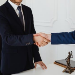 Nanda & Associate Lawyers Canada - A lawyer shaking hands with a client
