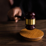 Nanda & Associate Lawyers Canada - A person holding a gavel