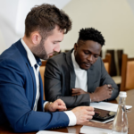 Nanda & Associate Lawyers Canada - Two Professionals Analyzing Documents Together