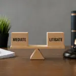 Business dispute decision concept showing mediation vs litigation balance on office desk with legal tools and documents