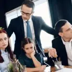 child custody lawyer consulting separated parents and child during legal discussion