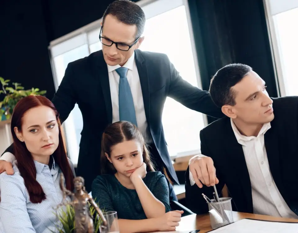 child custody lawyer consulting separated parents and child during legal discussion