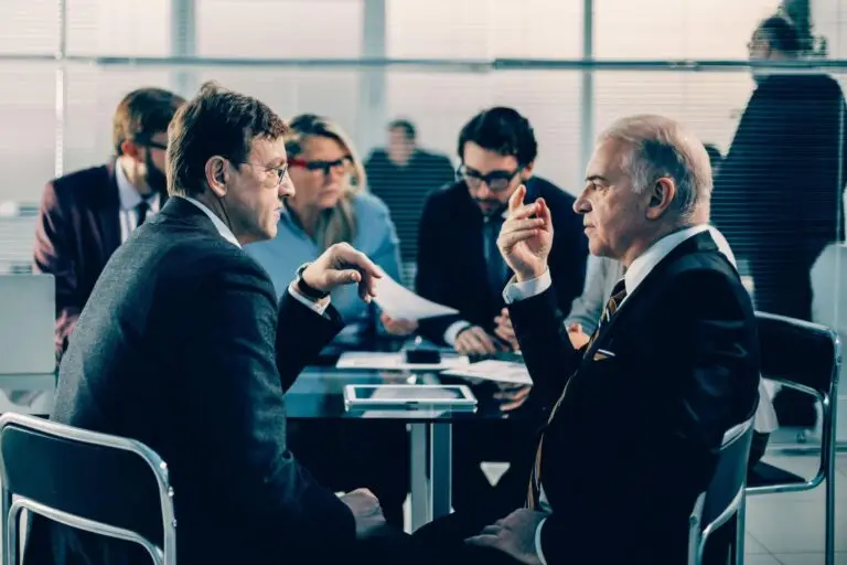 civil litigation lawyer Mississauga discussing legal dispute with client in office meeting